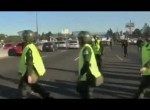 Argentine Policeman jumps on car